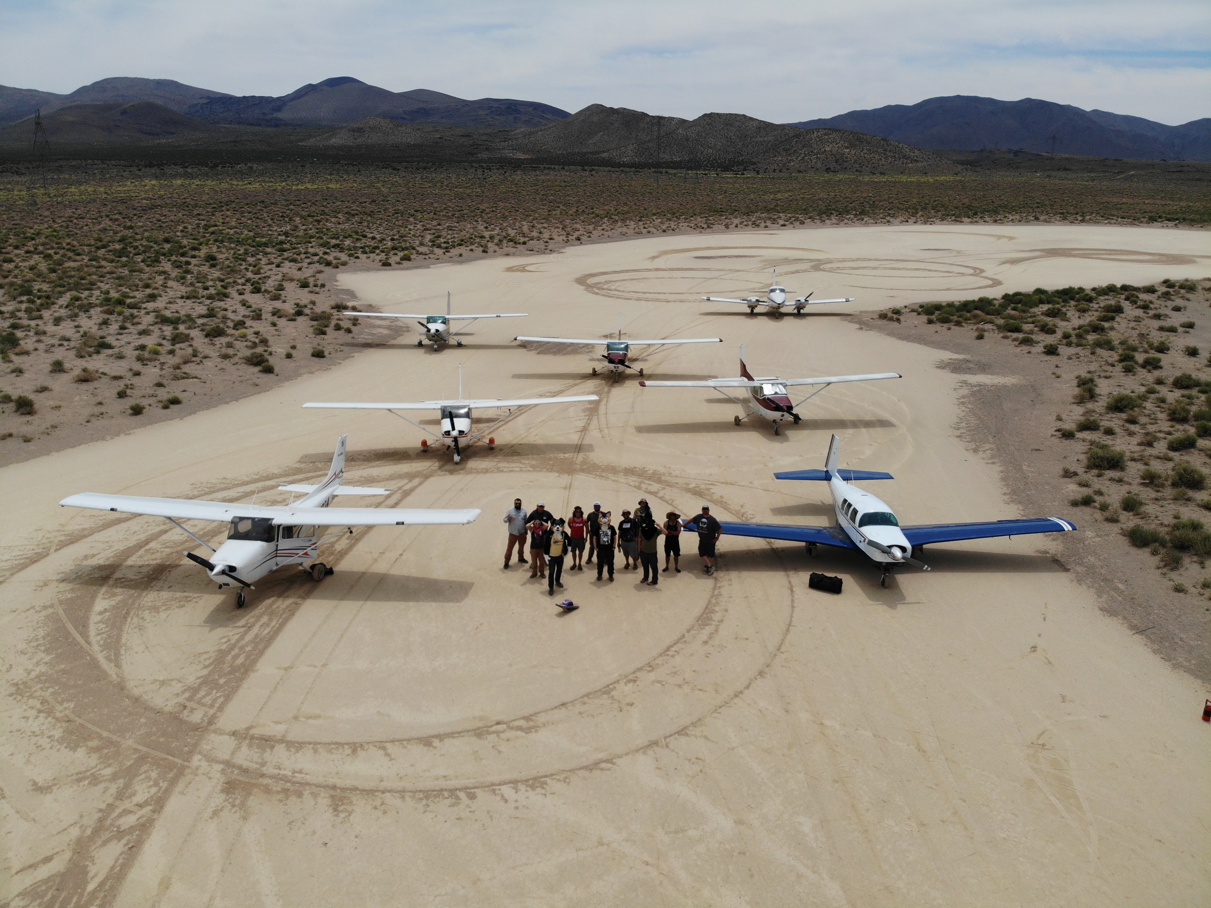Planes gathered on the playa at a TobyCon fly-in